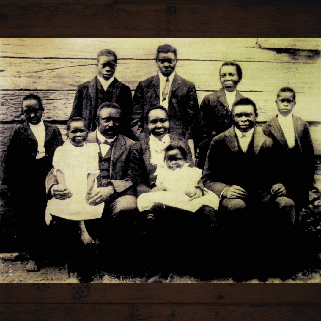 One of the earliest photos of the Hatcher family from the exhibit with 6 adults and 4 children 