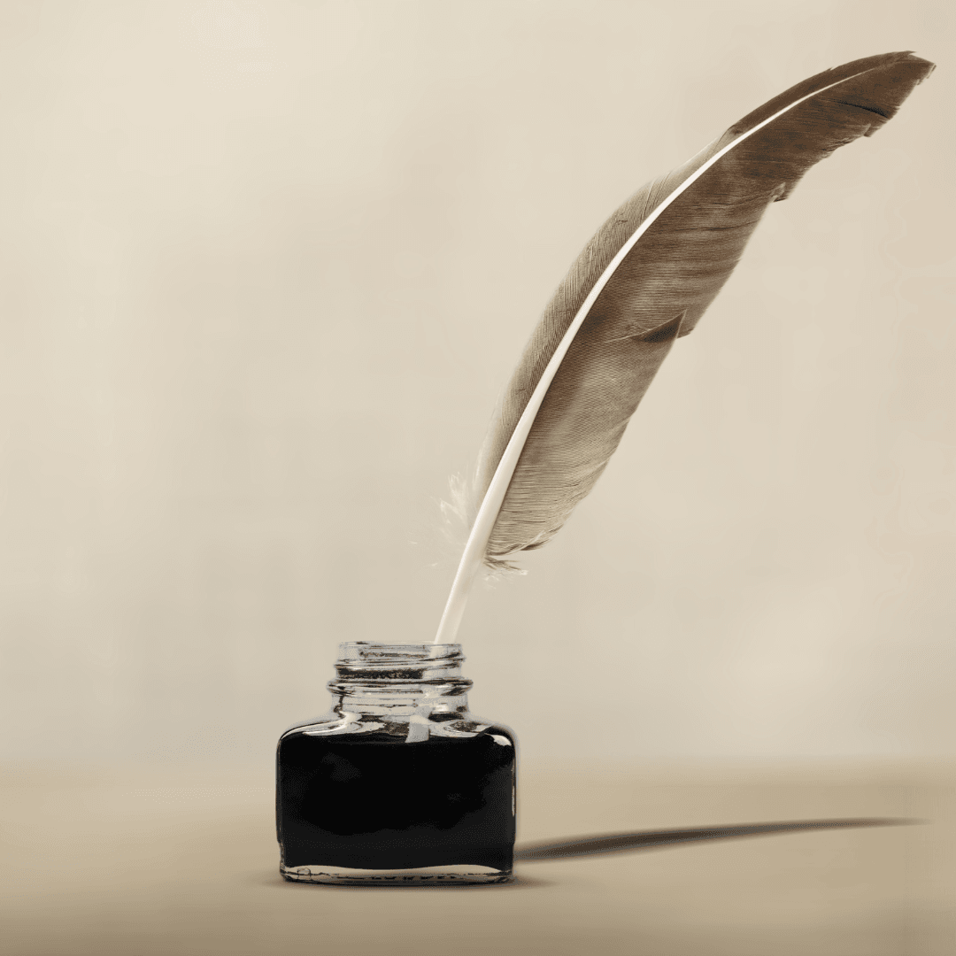 inkwell with a feather pen in it
