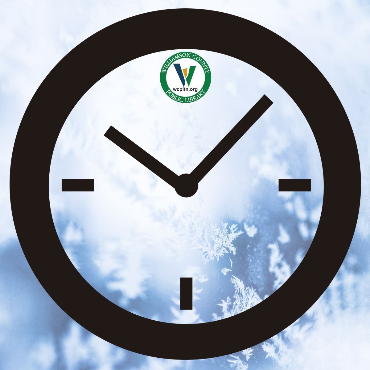 Clock with library logo on snowy background