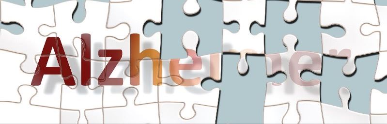 Puzzle with the word alzheimers on it and missing pieces